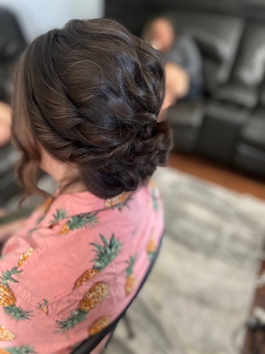 Soft curled updo hairstyle by Simran Khurana